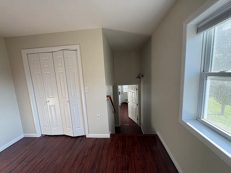 Stairway connecting living area, kitchen area, and coming in from Garage