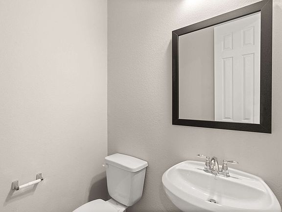 The powder room is conveniently located on the first floor and perfect for you and guests.