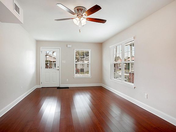 Open extra large living room 22'6" x 11'5", all window coverings included with cherry wood floors