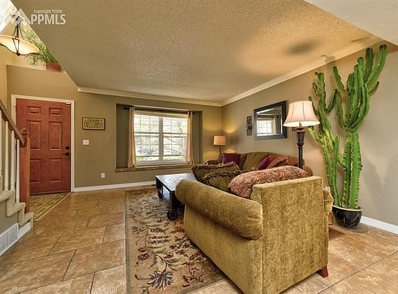 The living room with large window makes this entry, light and inviting
