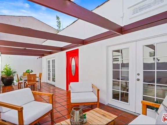 Front courtyard view with French doors leading to the living and dining rooms
