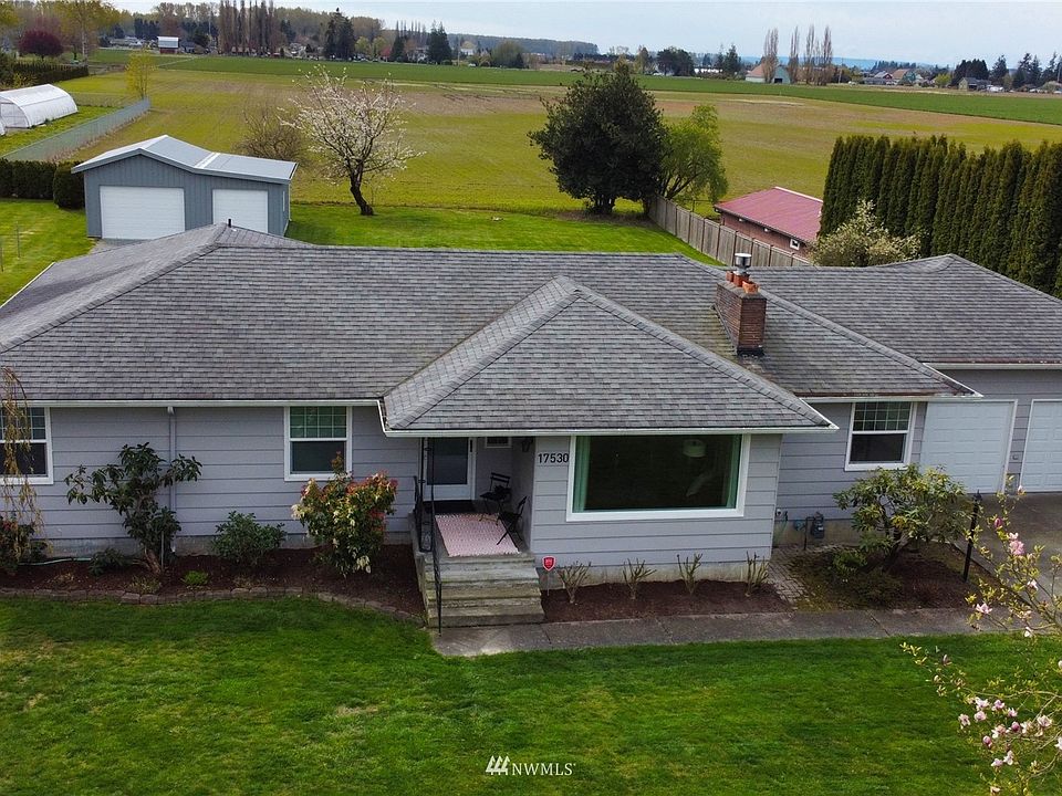 3 bedroom 2 bathroom mid century 1856sqft home with 1506sqft unfinished basement. Situated on .57 acre lot with shop in the lovely Skagit Valley farmland. House has been beautifully renovated throughout. View from front lot.