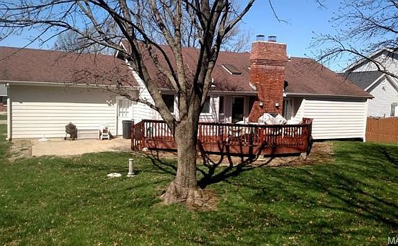 Large shaded back deck and patio with access to the great room a