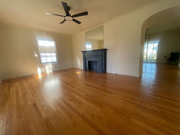 Living room with ornamental fireplace.