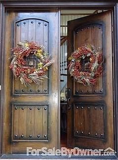 Front Doors
						:
						Massive Mahogany Castle Doors with baked finish - very low maintenance!