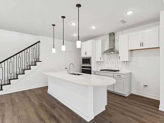 High-end gourmet kitchen with premium finishes and upgraded appliances Real home pictured