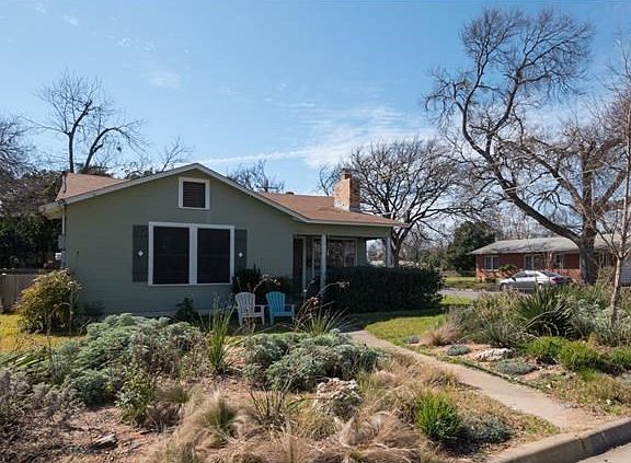 Front view showing xeriscaping.