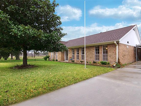 A long driveway is great for additional parking space. It leads to a 2 car detached garage. Replaced