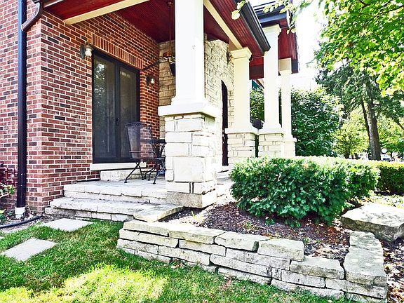 Side view of covered Veranda, dining room porch with French doors.