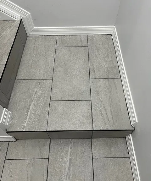 Stairwell, Brand New Tile and Grout, New Baseboard and Molding, Handrails, Chandelier Light. Freshly Painted Ceiling, Walls, Baseboards and Moldings.