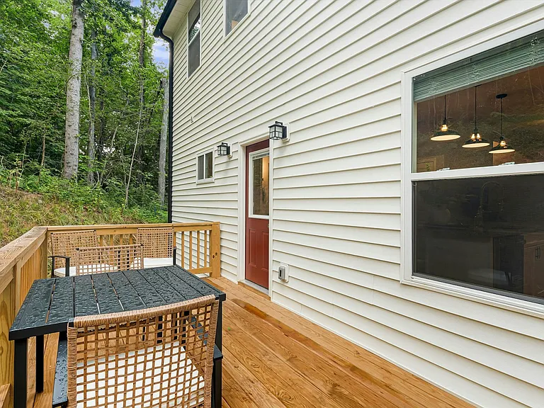 Rear porch with privacy and seating just off dining area