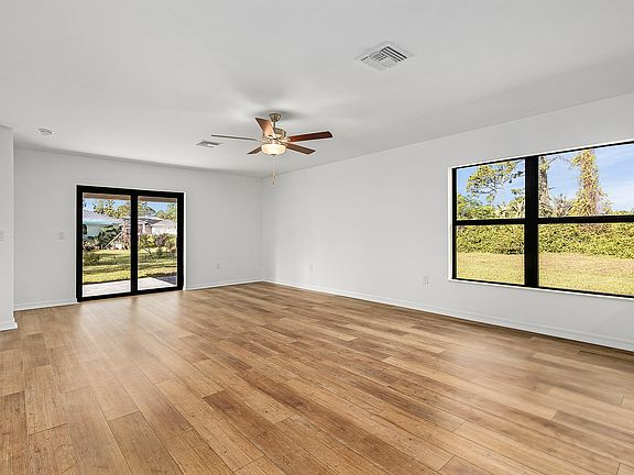 The family room is spacious with a sliding glass door to the back patio