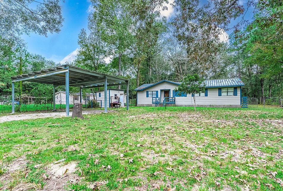 Welcome to 27981 Northgate Lane in Splendora subdivision! This adorable home is nestled behind mature trees and surrounded by greenery. A front porch and lots of windows decorate the front adding curb appeal.