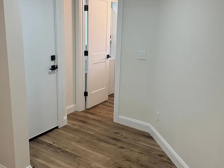 View of hall toward bathroom from living room