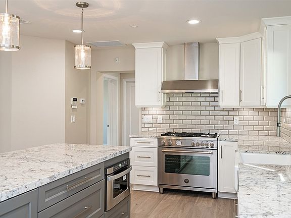 Stainless appliances including a microwave drawer.