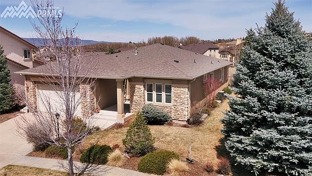 great one owner ranch design backing up to Pine Creek open space.