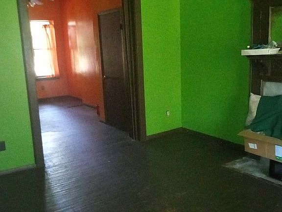 Sliding doors connect the rooms