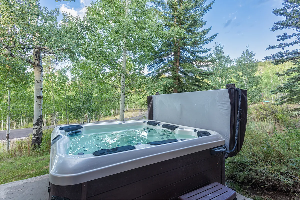 Enjoy this private, year round hot tub just steps from the door. - 21 Pommel Pl