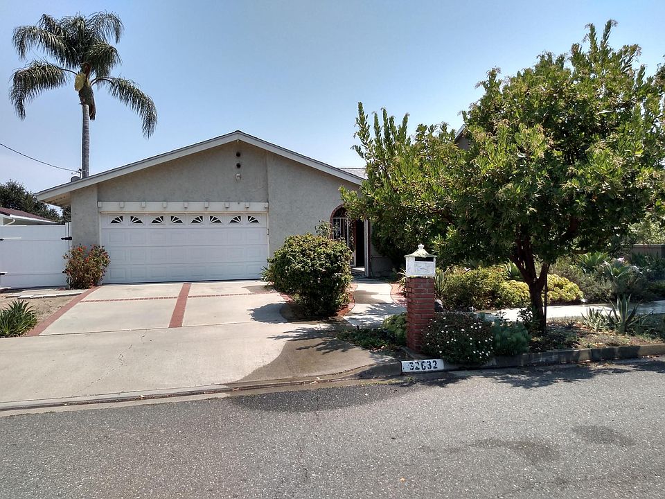 Street view with 2-car garage.