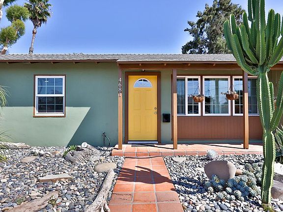 Dry-scaped front yard space with various succulents and beach vibes!
