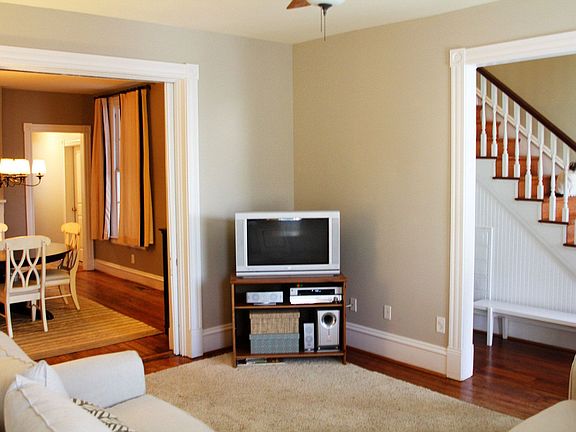 Restored trim, original pocket doors adjoin living and dining rooms