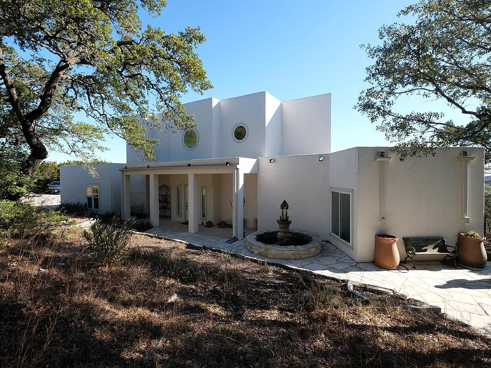 front of house has plenty of room for hanging out and enjoying the landscape.