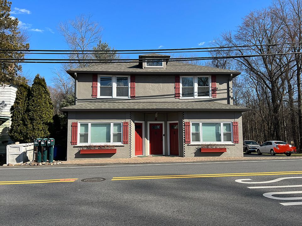 Corner Multi-Family. Center Door leads upstairs to entire 2nd Floor Apt. Front right is a bdrm. Front Left is the living room. Windows surround each room. Spacious and well lit 3 bdrm apt.
