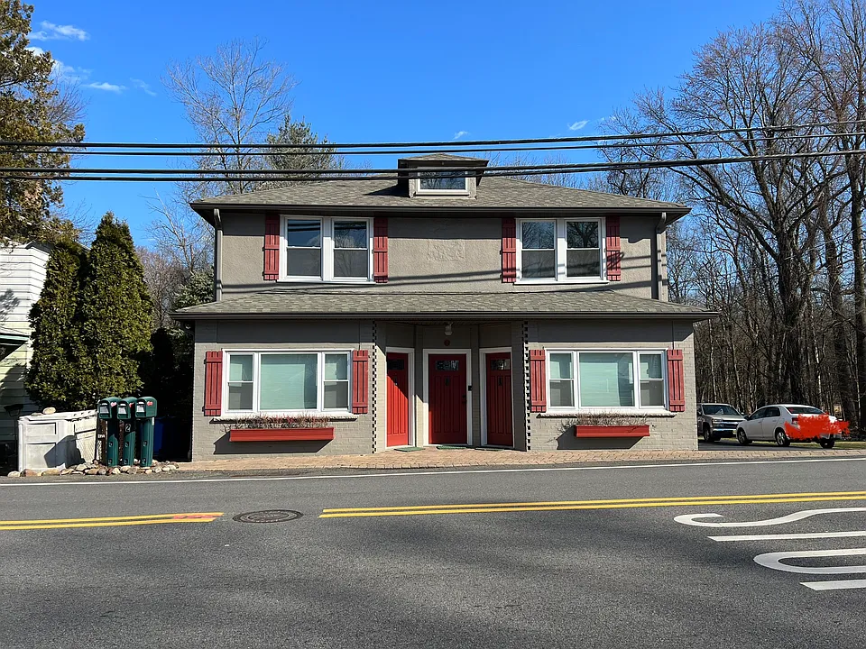 Corner Multi-Family. Center Door leads upstairs to entire 2nd Floor Apt. Front right is a bdrm. Front Left is the living room. Windows surround each room. Spacious and well lit 3 bdrm apt.