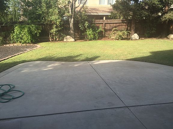 back yard has rubber bark area