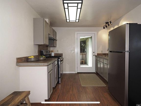 One Bedroom full kitchen with gas stove and concrete countertops