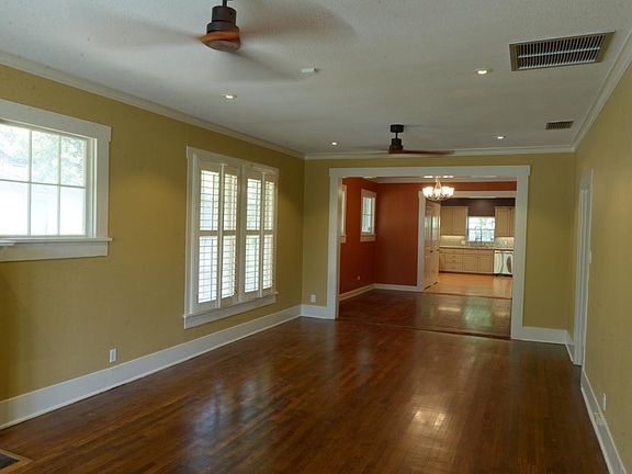 Living room with recessed lighting and 2 ceiling fans
