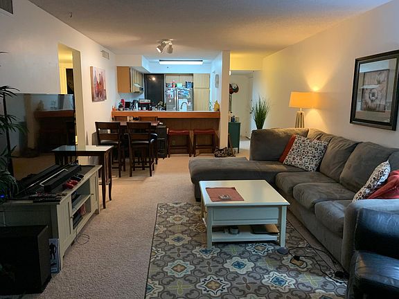 Living room. Balcony is behind