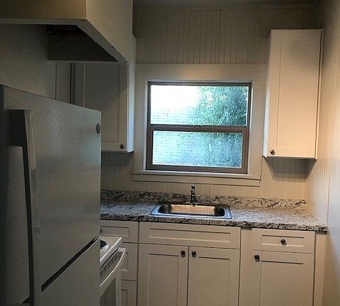 Apt 1, New cabinets, appliances and flooring.