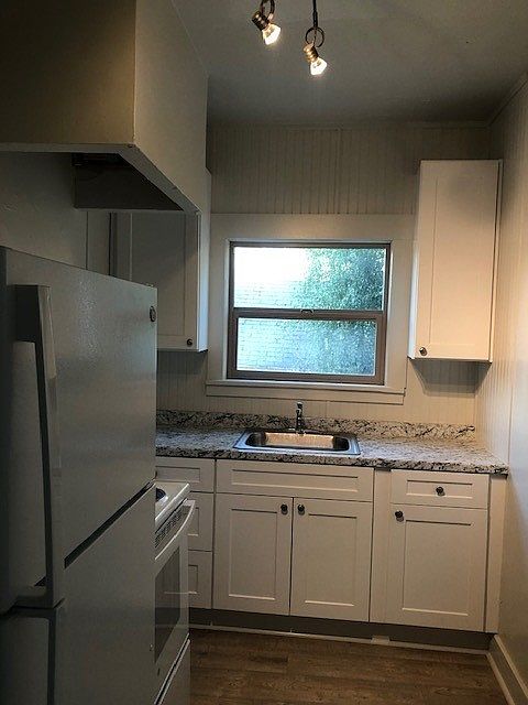 Apt 1, New cabinets, appliances and flooring.