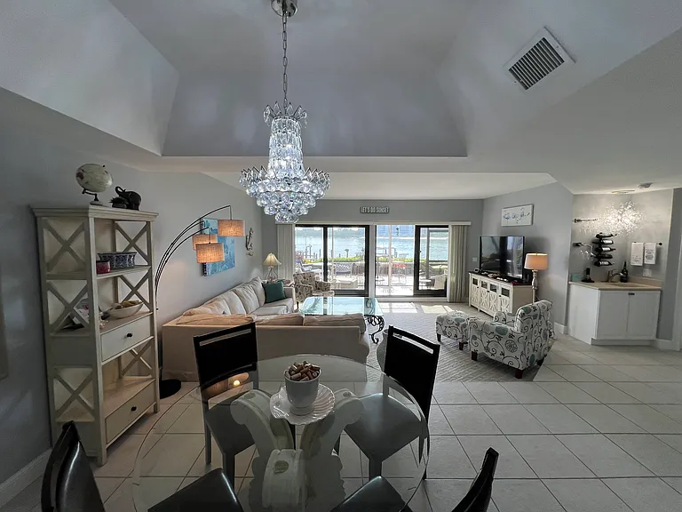 Standing in kitchen looking at dining area and living room. And the best part_.the water view!
