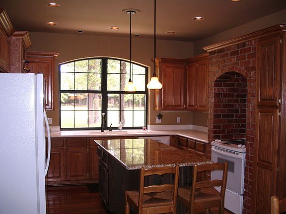 KITCHEN W/CENTER ISLAND & SOLID SURFACE COUNTERTOPS