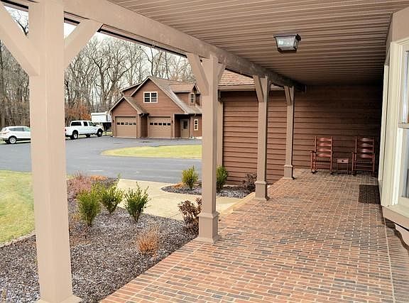 FRONT PORCH WITH VIEW TO GUEST LODGE