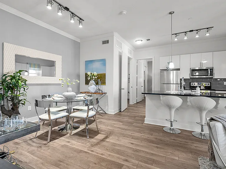 Experience sleek elegance in this fully-equipped contemporary dining and kitchen space. Experience sleek elegance in this fully-equipped contemporary dining and kitchen space.