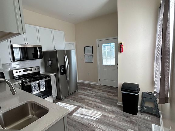 Kitchen with a microwave