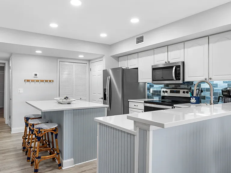 Spacious kitchen with bar and island
