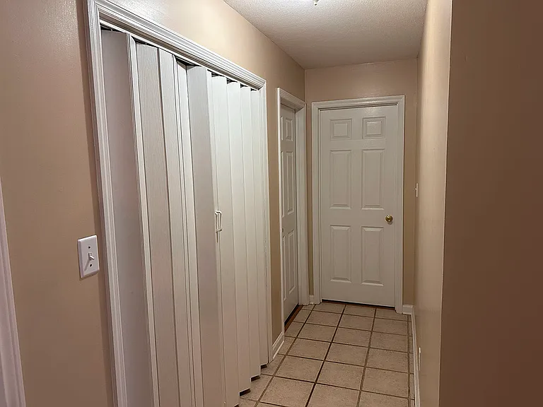 Laundry room beside bedroom #1 & bedroom #2.