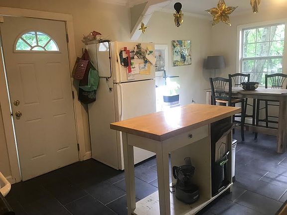 Side door entry into eat in kitchen