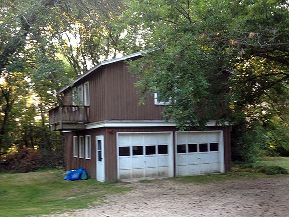 Two car detached garage. Both doors are equipped with garage