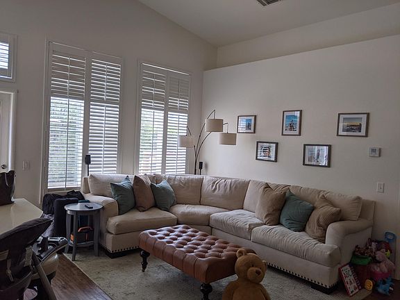 Living room with vaulted ceilings and fireplace
