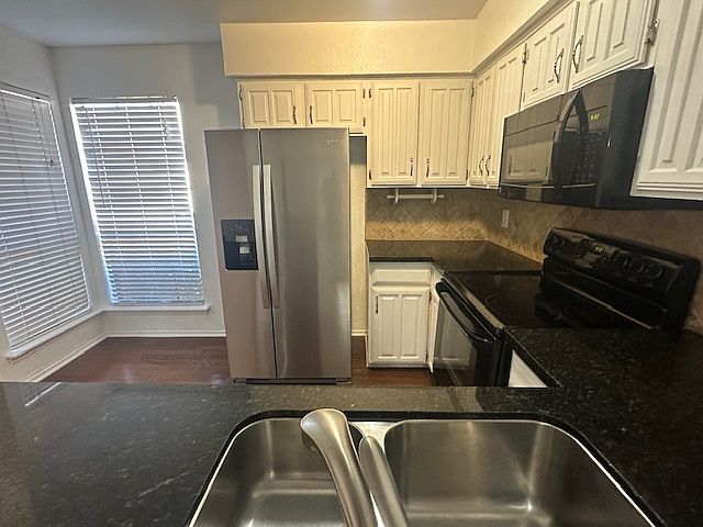 Kitchen with granite counters and windows for great natural light