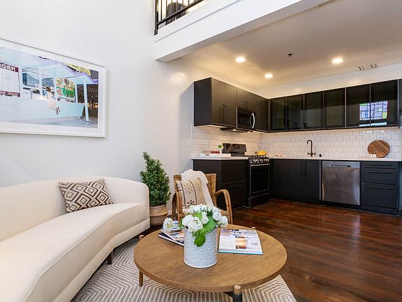 Main living area and fully remodeled gourmet kitchen with stainless steel appliances