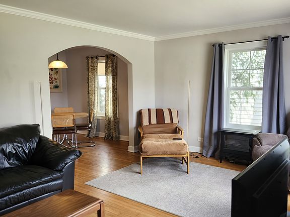 Living room with view into dining area.