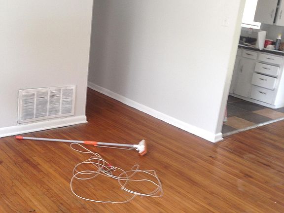 just painted light gray, hardwood floors throughout