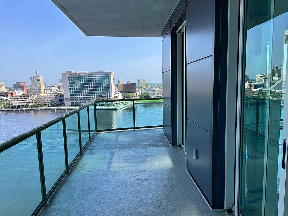 Side balcony with bedroom entrance and windows
