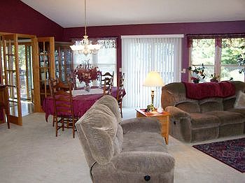 Formal dining area is located at one end of the family room.
